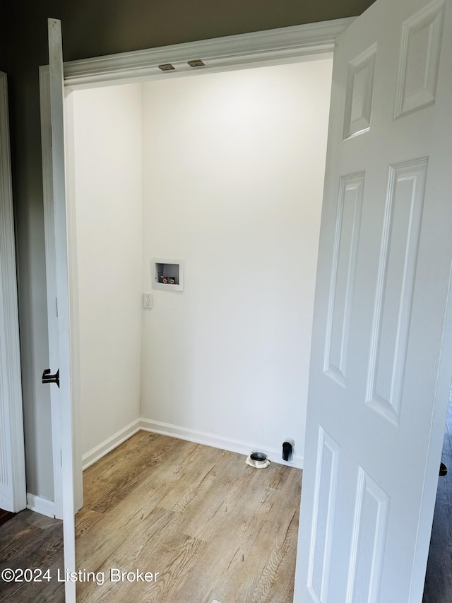 laundry room with light wood-type flooring and hookup for a washing machine