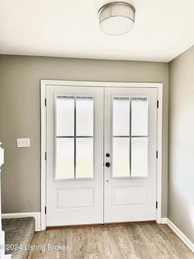 entryway with light wood-type flooring and a healthy amount of sunlight