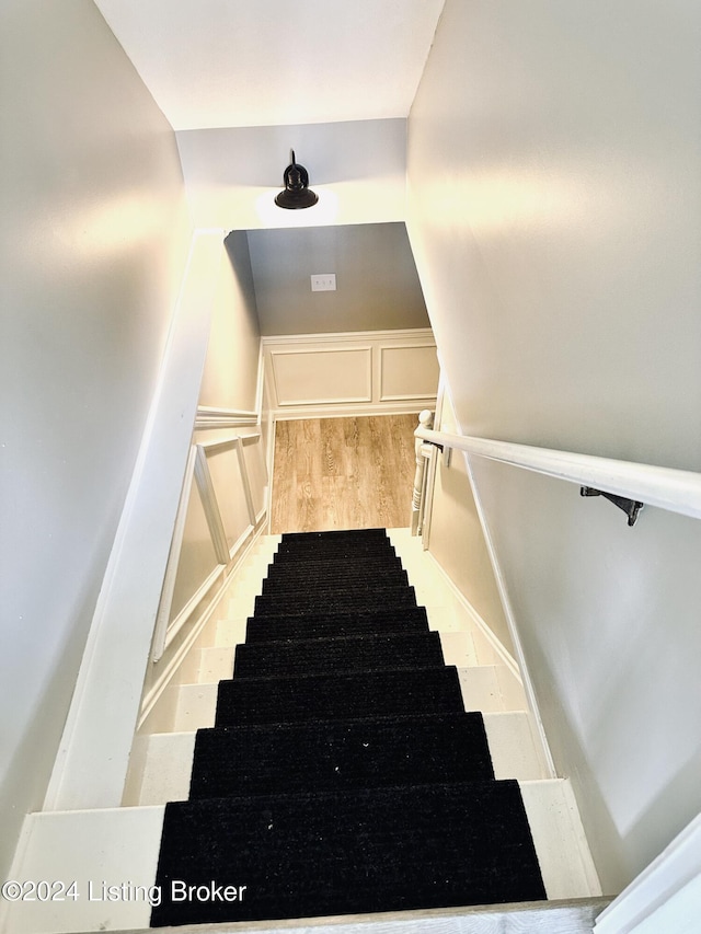 stairs with wood-type flooring