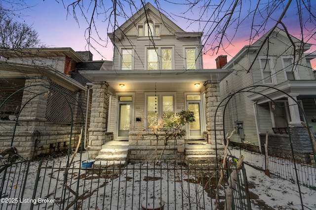 view of front of property featuring covered porch