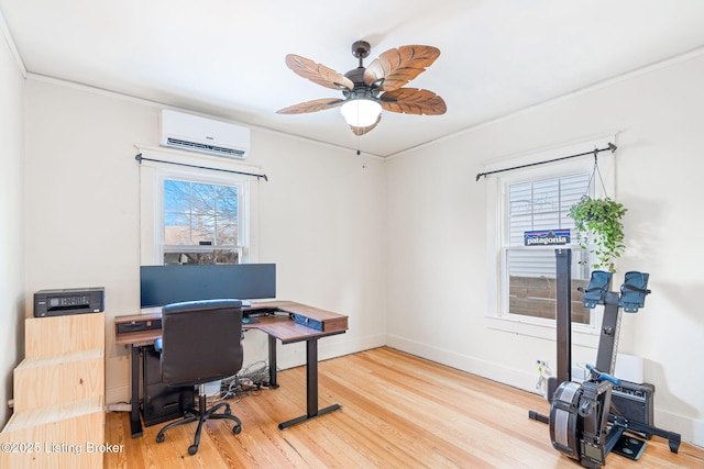 office space with crown molding, hardwood / wood-style flooring, a wall mounted AC, and ceiling fan