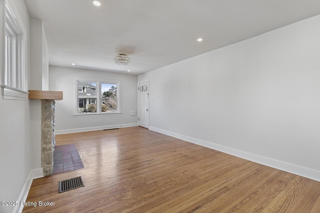 unfurnished living room featuring light hardwood / wood-style floors