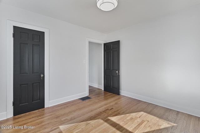 empty room with light wood-type flooring