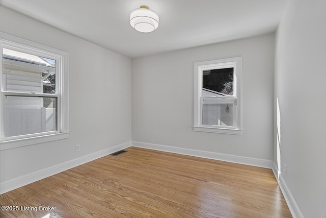 spare room with light wood-type flooring