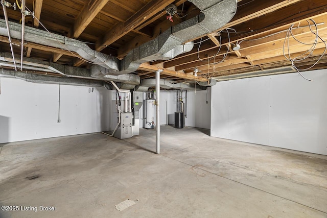 basement featuring heating unit and water heater