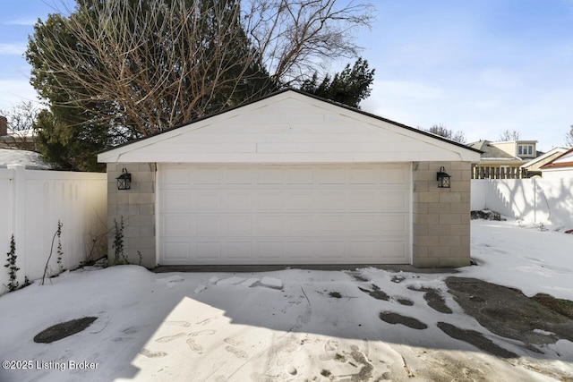 view of snow covered garage