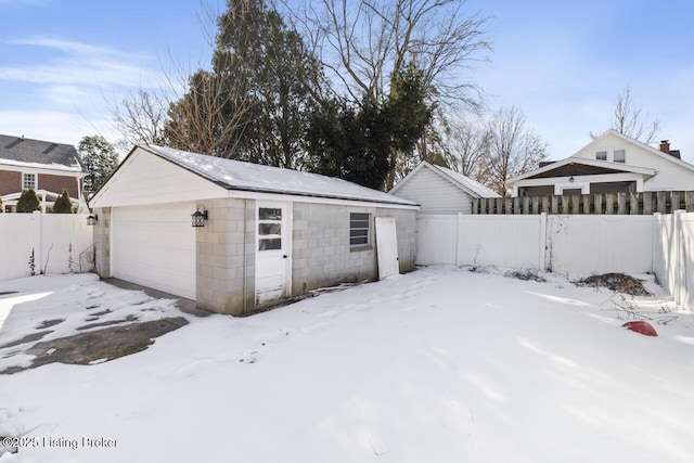 view of snow covered garage