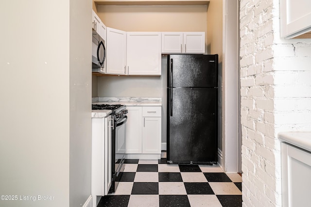 kitchen with white cabinetry and black appliances