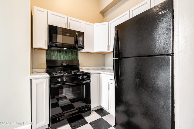 kitchen featuring black appliances and white cabinets