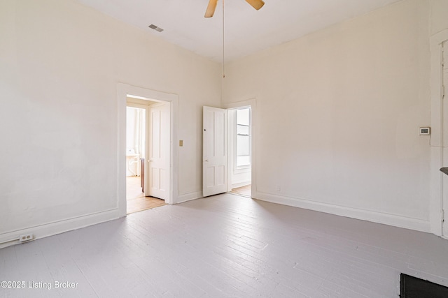 spare room featuring light wood-type flooring and ceiling fan