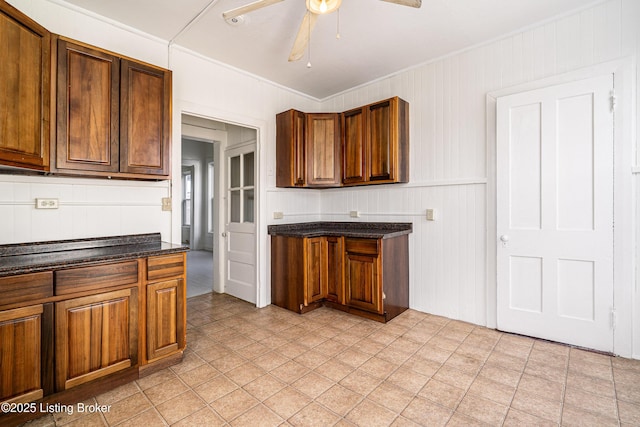 kitchen featuring crown molding and ceiling fan