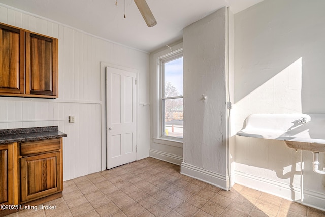 kitchen featuring ceiling fan and a healthy amount of sunlight