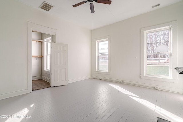 unfurnished bedroom featuring light hardwood / wood-style floors and ceiling fan