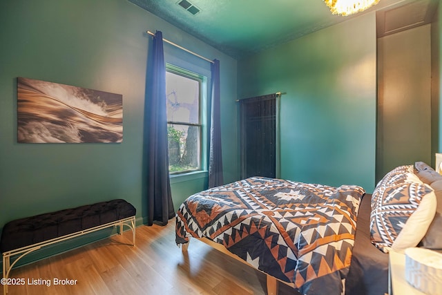 bedroom featuring hardwood / wood-style floors