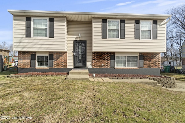 split foyer home with a front lawn