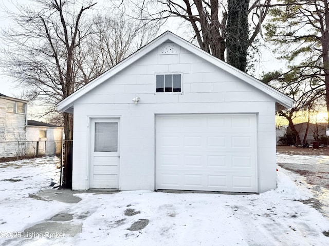 view of snow covered garage