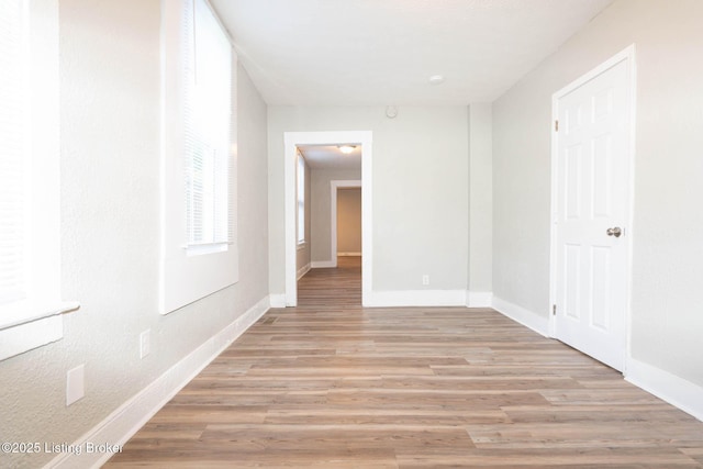 corridor featuring light wood-type flooring