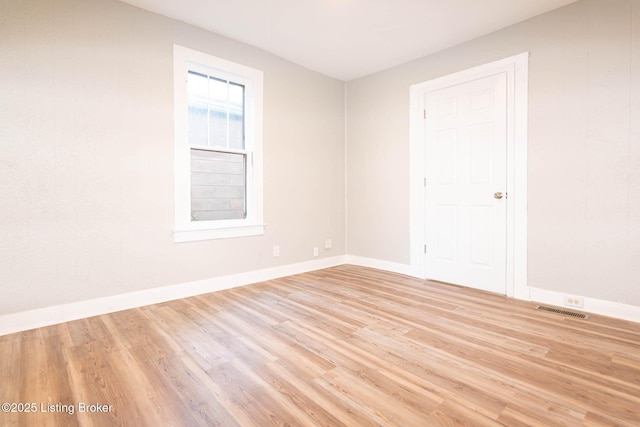 unfurnished room with light hardwood / wood-style floors