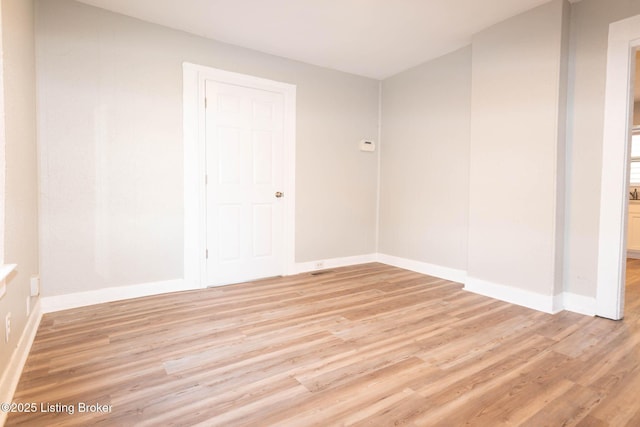 empty room featuring light hardwood / wood-style floors