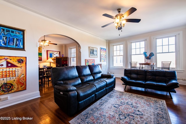 living room with crown molding, dark hardwood / wood-style floors, and ceiling fan