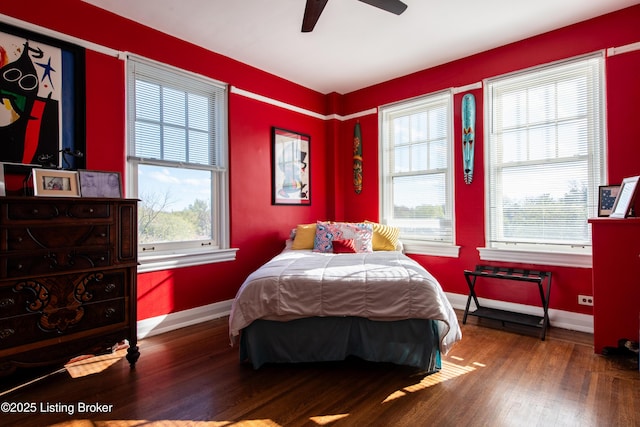 bedroom with hardwood / wood-style flooring and ceiling fan