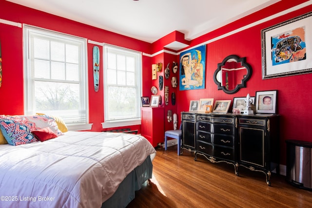 bedroom with hardwood / wood-style floors