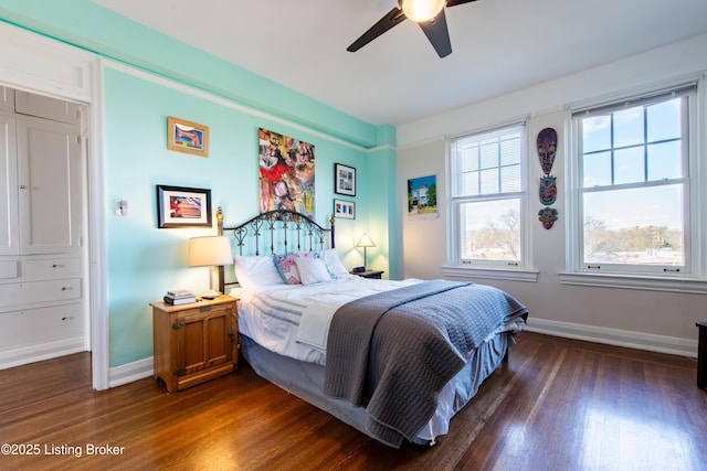 bedroom featuring ceiling fan and dark hardwood / wood-style floors