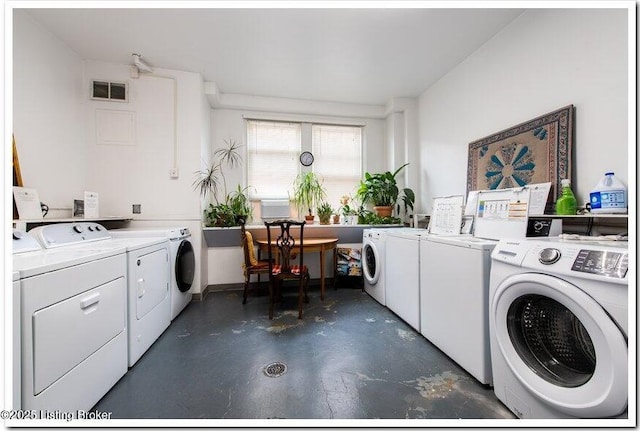 laundry area with washing machine and dryer