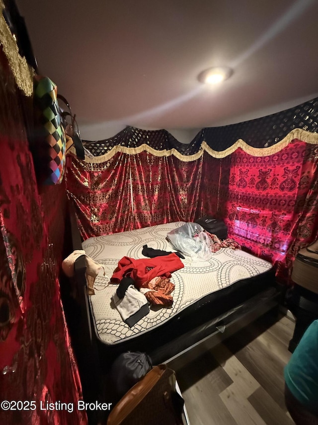 bedroom featuring hardwood / wood-style flooring