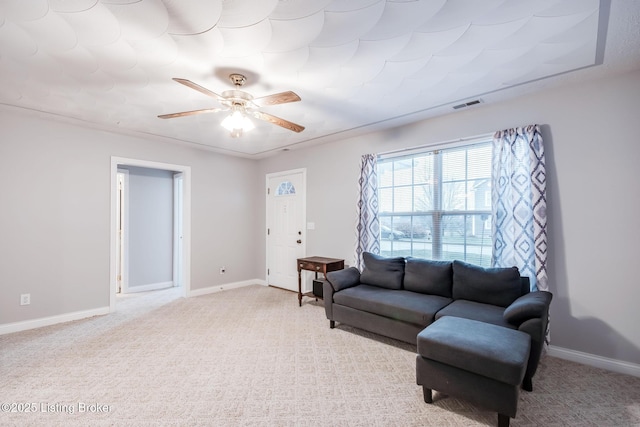 carpeted living room featuring ceiling fan