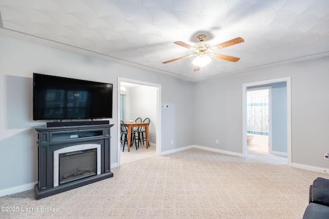 living room featuring ceiling fan and light colored carpet