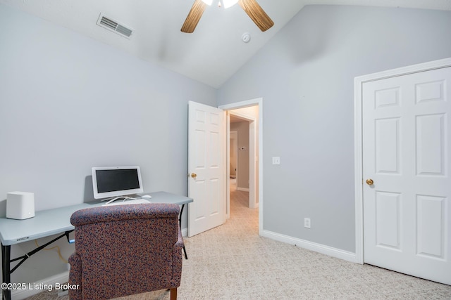 home office featuring light carpet, ceiling fan, and lofted ceiling