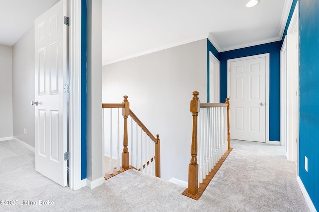 corridor featuring light carpet and ornamental molding