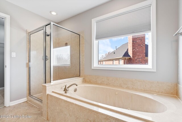 bathroom featuring tile patterned flooring and plus walk in shower