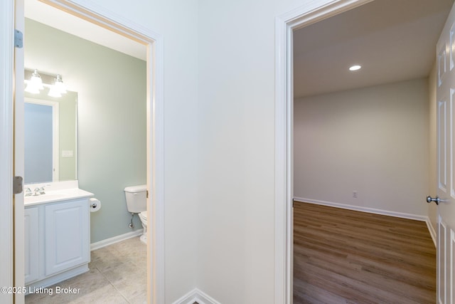 bathroom with toilet and vanity