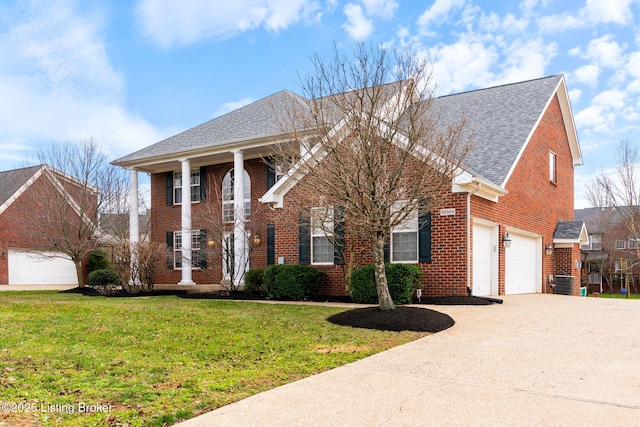 view of front of home featuring a garage, central air condition unit, and a front lawn