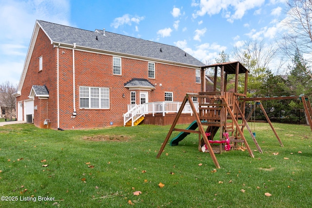 view of play area with a yard and central AC