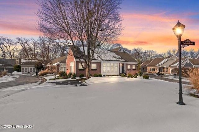 view of front of property with a residential view and driveway