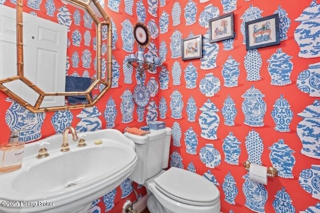 bathroom featuring sink and toilet