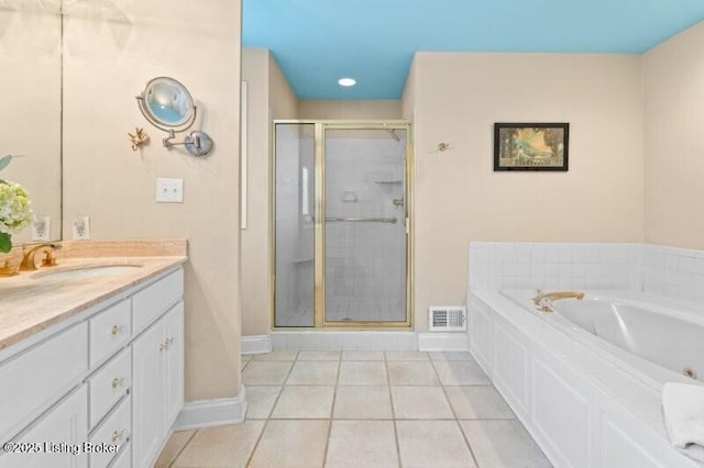 bathroom with tile patterned flooring, visible vents, a stall shower, a bath, and vanity