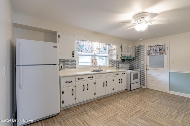 kitchen with sink, white appliances, decorative backsplash, and white cabinets