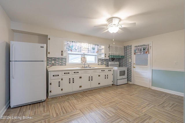 kitchen featuring white cabinets, white appliances, and decorative backsplash