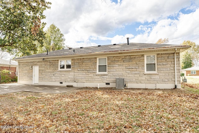 rear view of house featuring central air condition unit and a patio