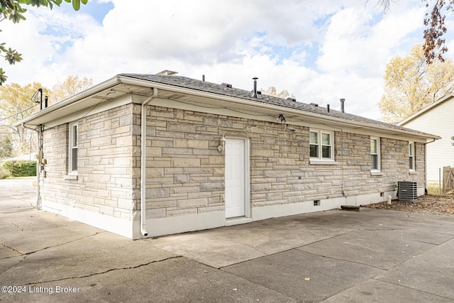 view of home's exterior with a patio and central AC unit