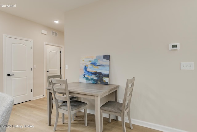 dining space featuring light wood-style floors, baseboards, visible vents, and recessed lighting