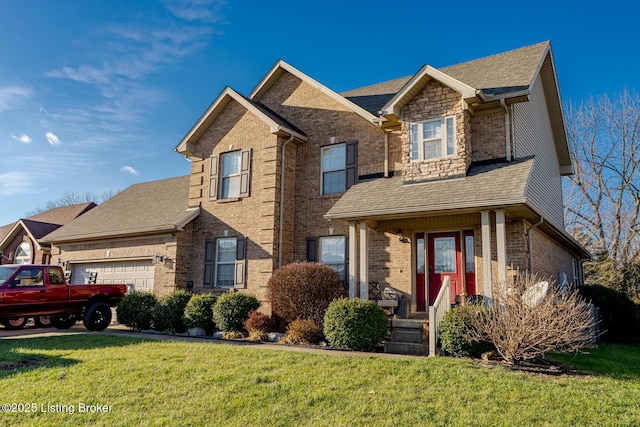 view of front of property with a garage and a front yard