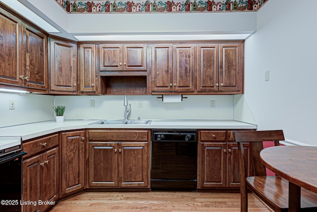 kitchen with dishwasher, sink, light wood-type flooring, and electric stove