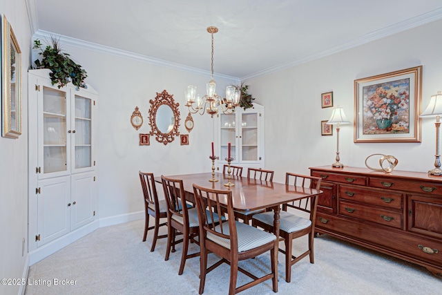 dining room with crown molding, light carpet, and an inviting chandelier