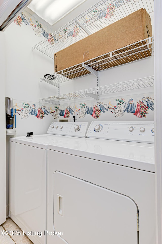 washroom featuring washer and dryer and light tile patterned floors