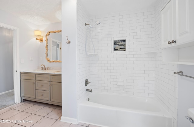 bathroom featuring tile patterned flooring, vanity, tiled shower / bath combo, and a textured ceiling